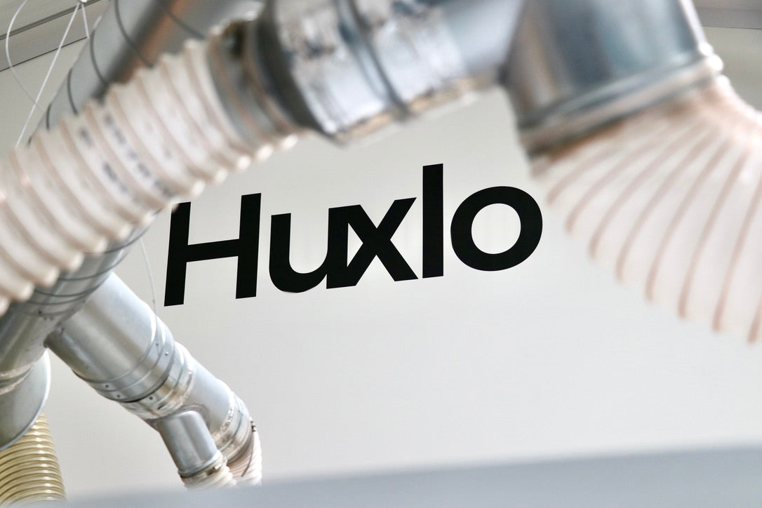 Huxlo Branding on Wall
